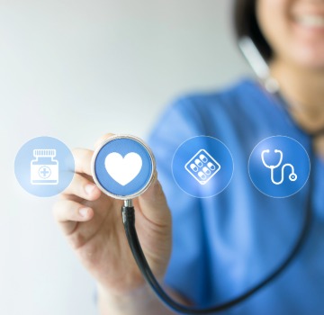 medial person holding a stethoscope up to a heart icon